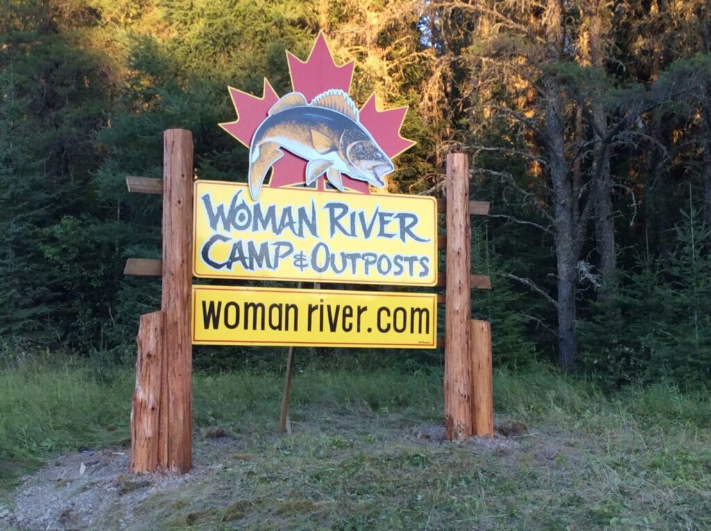 Woman River Camp & Outpost billboard sign
