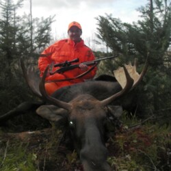 hunter with moose