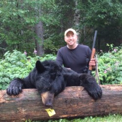 hunter with black bear