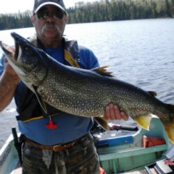 Man holding up fish he just caught