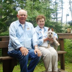 dogs visiting woman river camp