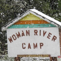 woman river camp