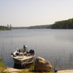boar anchored on lake